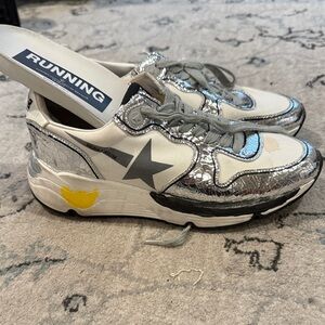 Authentic Golden Goose running sneakers. They are labeled a size 36.